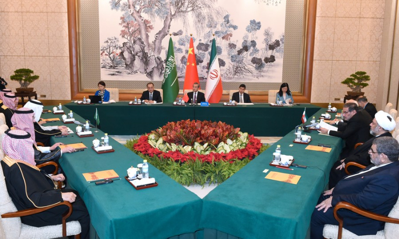 Wang Yi, a member of the Political Bureau of the Communist Party of China (CPC) Central Committee and director of the Office of the Foreign Affairs Commission of the CPC Central Committee, presides over the closing meeting of the talks between a Saudi delegation and an Iranian delegation in Beijing, capital of China, March 10, 2023. (Xinhua/Luo Xiaoguang)