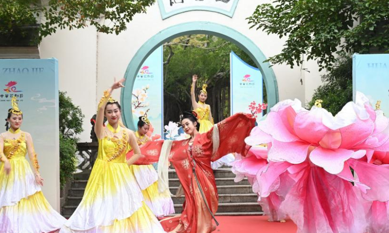 People perform to celebrate Hua Zhao Jie, meaning Flower Festival, at a park in Fuzhou, southeast China's Fujian Province, March 11, 2023. (Xinhua/Lin Shanchuan)