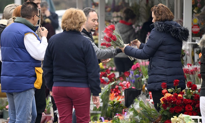 People buy flowers on International Women's Day in the city center of Skopje, North Macedonia, March 8, 2023.(Photo: Xinhua)
