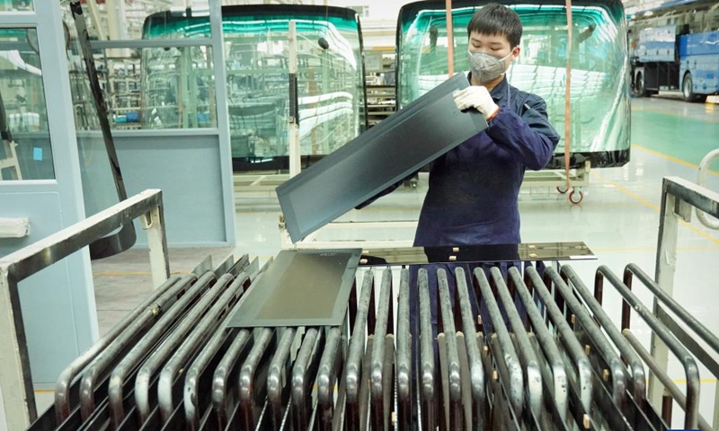A staff member works at a work shop of the new energy factory of Zhengzhou Yutong Bus Co., Ltd. in Zhengzhou, central China's Henan Province, March 8, 2023. To catch orders, staff of the new energy factory of Yutong are busy on the assembly line. Since the beginning of this year, Yutong. who exported its bus to more than 30 countries and regions, has won many overseas orders.(Photo: Xinhua)