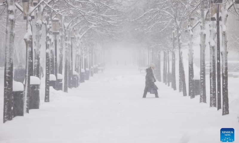 A pedestrian walks amid snow in Stockholm, Sweden, March 8, 2023. Public transport in and around the Swedish capital was severely disrupted on Wednesday as heavy blizzards swept across the country.(Photo: Xinhua)