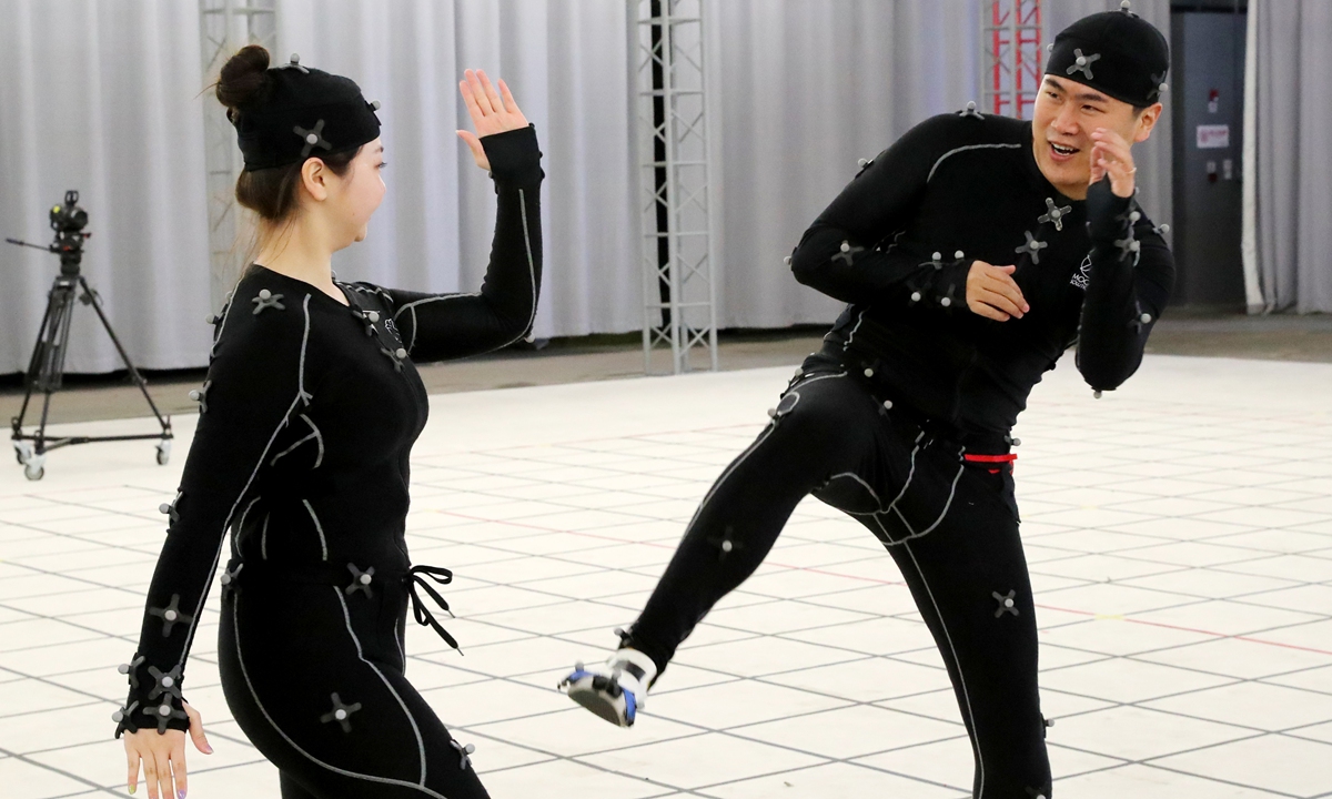 Staff members demonstrate motion capture technology at the Qingdao Oriental Movie Metropolis. Photo: IC