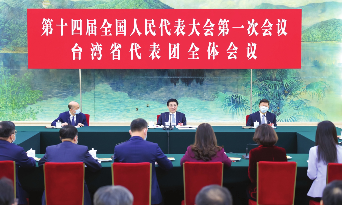 Wang Huning (center), member of the Standing Committee of the Political Bureau of the Communist Party of China Central Committee attends a deliberation with deputies from the Taiwan delegation of the first session of the 14th National People's Congress on March 9, 2023. Photo: Xinhua