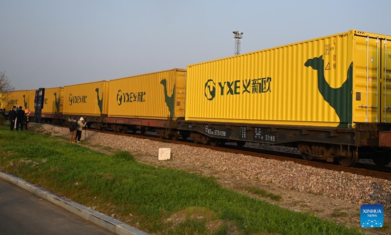 A freight train departs from Yiwu West Railway Station in Yiwu, east China's Zhejiang Province, March 9, 2023. A China-Europe train carrying 100 standard containers of China-made small commodities and ceramic products left Yiwu, a major hub of small commodities in east China's Zhejiang Province, for Madrid, Spain, Thursday. The commemoration trip came as Thursday marked the 50th anniversary of diplomatic relations between China and Spain.(Photo: Xinhua)