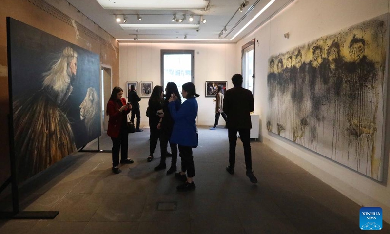 Visitors attend an art exhibition at Beit Beirut in Beirut, Lebanon, on March 8, 2023. The art exhibition entitled Your Voice, Your Power was held here on Wednesday, on the occasion of International Women's Day.(Photo: Xinhua)