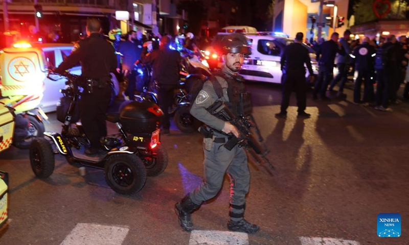 Police and emergency service members work at the scene of a shooting attack on Dizengoff street in Tel Aviv, Israel, on March 9, 2023. A gun-wielding Palestinian man opened fire on a busy street in the Israeli city of Tel Aviv on Thursday night, injuring three individuals in what was described by Israeli officials as a terror attack.(Photo: Xinhua)