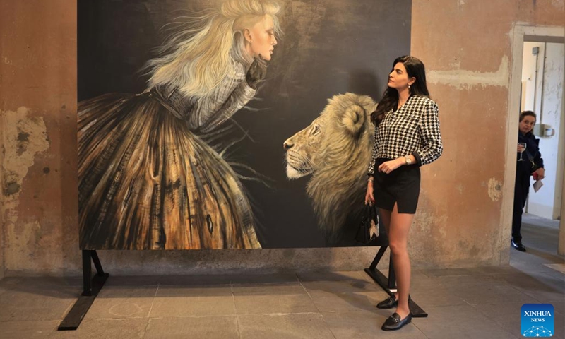 A visitor attends an art exhibition at Beit Beirut in Beirut, Lebanon, on March 8, 2023. The art exhibition entitled Your Voice, Your Power was held here on Wednesday, on the occasion of International Women's Day.(Photo: Xinhua)