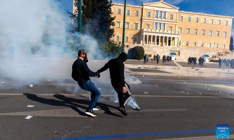 Protesters clash with riot police during a demonstration in front of the Greek Parliament in Athens, Greece, on March 8, 2023. Greek government announced a set of measures aimed to improve the safety of railway system on Wednesday, in the wake of the train collision last week in central Greece that resulted in 57 deaths. (Photo: Xinhua)