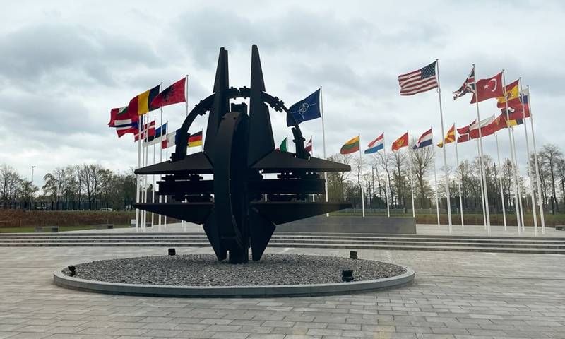 This photo taken on April 6, 2022 shows a sculpture and flags at NATO headquarters in Brussels, Belgium.(Photo: Xinhua)