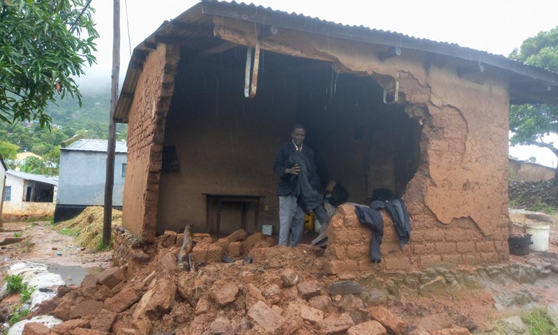 A man sorts items in his house damaged by flash floods in Chilobwe, Blantyre, Malawi, on March 13, 2023. The death toll from Tropical Cyclone Freddy in Malawi reached 99 Monday evening with 85 deaths recorded in the commercial city of Blantyre alone, authorities have confirmed.(Photo: Xinhua)