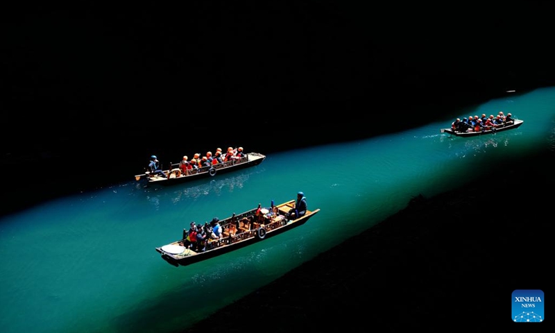 Tourists enjoy boat rides in the Pingshan canyon, a tourist attraction famous for its limpid water, in Hefeng County, Enshi Tujia and Miao Autonomous Prefecture, central China's Hubei Province, March 14, 2023.(Photo: Xinhua)