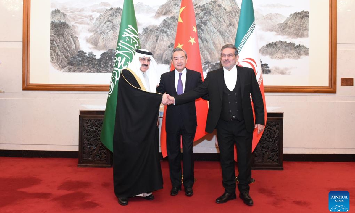 Wang Yi (C), a member of the Political Bureau of the Communist Party of China (CPC) Central Committee and director of the Office of the Foreign Affairs Commission of the CPC Central Committee, attends a closing meeting of the talks between the Saudi delegation led by Musaad bin Mohammed Al-Aiban (L), Saudi Arabia's Minister of State, Member of the Council of Ministers and National Security Advisor, and Iranian delegation led by Admiral Ali Shamkhani (R), Secretary of the Supreme National Security Council of Iran, in Beijing, capital of China, March 10, 2023. (Xinhua/Luo Xiaoguang)