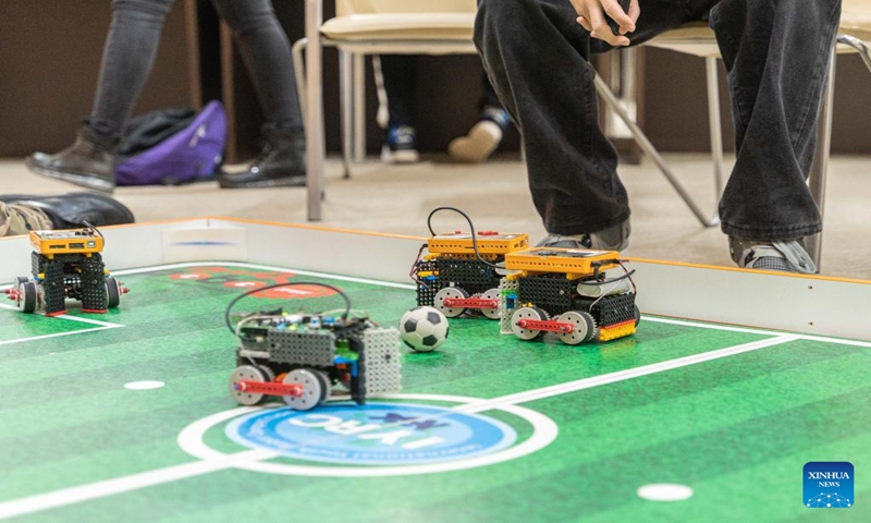 Robots compete in a soccer game in Vlapostok, Russia, March 11, 2023. The Russian far east youth robot soccer competition is held at the Far Eastern Federal University here Saturday. Students from cities as Vlapostok, Nakhodka and Khabarovsk come to compete with robots they assembled by themselves. (Photo: Xinhua)