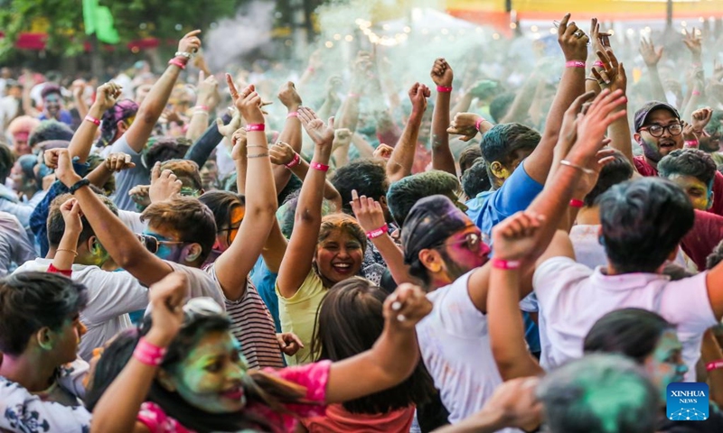 People celebrate the Holi Festival in Pasay City, the Philippines, March 11, 2023. The Hindu festival Holi, also known as the Festival of Colors, is celebrated by Hindu residents around the world. (Photo:Xinhua)
