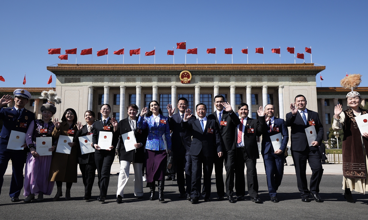 Deputies to the 14th National People's Congress (NPC) leave the Great Hall of the People after the fifth plenary session of
the 14th NPC in Beijing on March 12, 2023. Photo: VCG