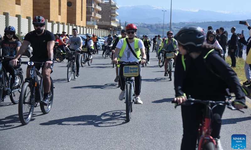 Cyclists participate in a riding activity in Tripoli, north Lebanon, March 11, 2023. (Photo by Khaled Habashiti/Xinhua)