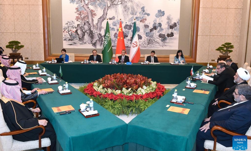 Wang Yi, a member of the Political Bureau of the Communist Party of China (CPC) Central Committee and director of the Office of the Foreign Affairs Commission of the CPC Central Committee, presides over the closing meeting of the talks between a Saudi delegation and an Iranian delegation in Beijing, capital of China, March 10, 2023.(Photo:Xinhua)