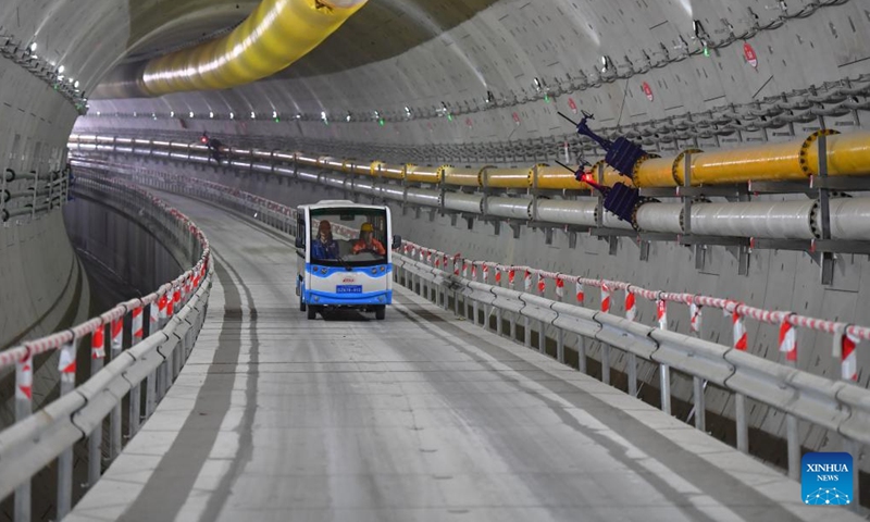 Workers of China Railway 14th Bureau Group Corporation Limited patrol in the right-line tunnel of the Xiangya Road river-crossing passway in Changsha, central China's Hunan Province, March 12, 2023. The drill-through of the right-line tunnel, together with the left-line tunnel drilled through a year ago, means the construction of the main part of the two-way river-crossing passway is near completion. (Xinhua/Chen Zeguo)