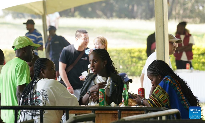 People rest during the first Kenya Tsingtao Beer Festival in Nairobi, Kenya, March 11, 2023. The first Kenya Tsingtao Beer Festival was held here on Saturday. (Xinhua/Han Xu)
