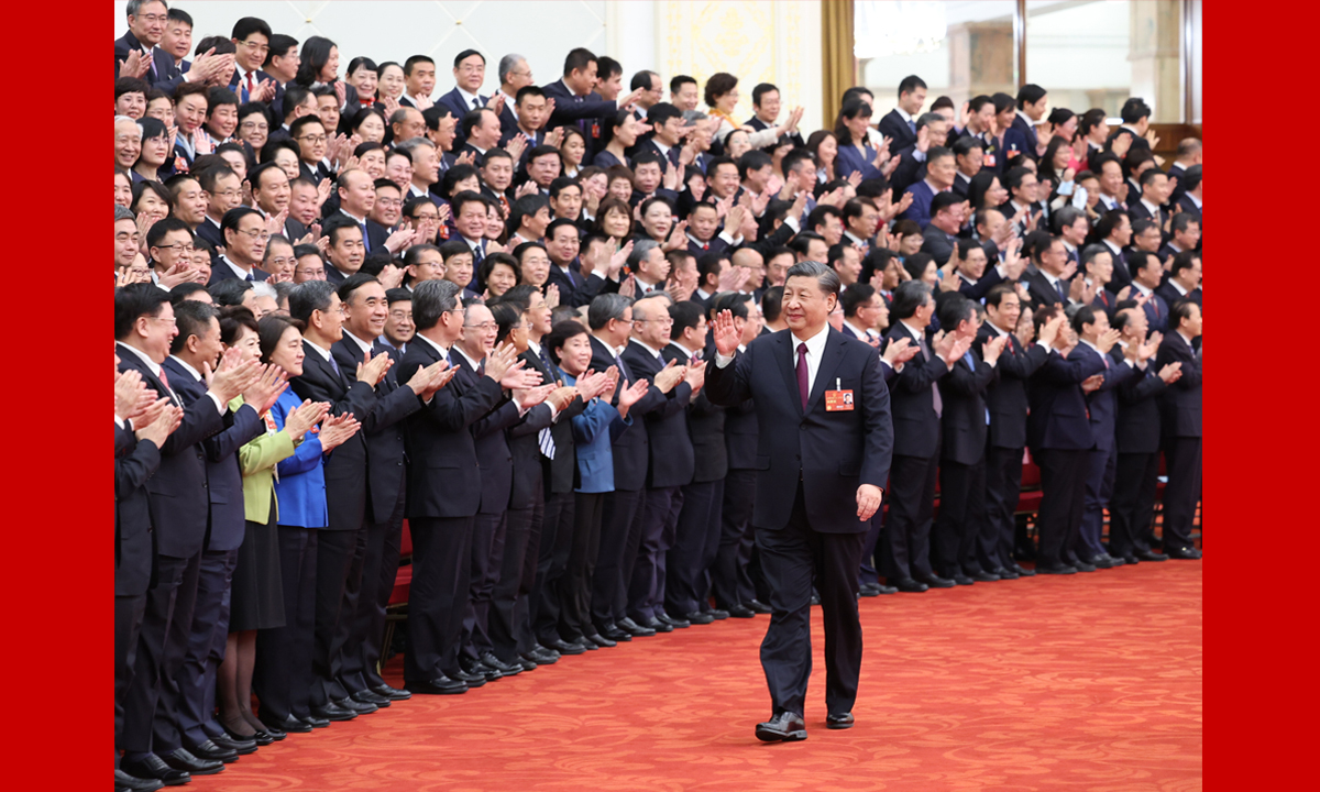 Chinese President Xi Jinping waves to deputies to the 14th National People's Congress (NPC), China's national legislature, as the closing meeting of the 1st session of the 14th NPC is held at the Great Hall of the People in Beijing on March 13, 2023. Photo: Xinhua