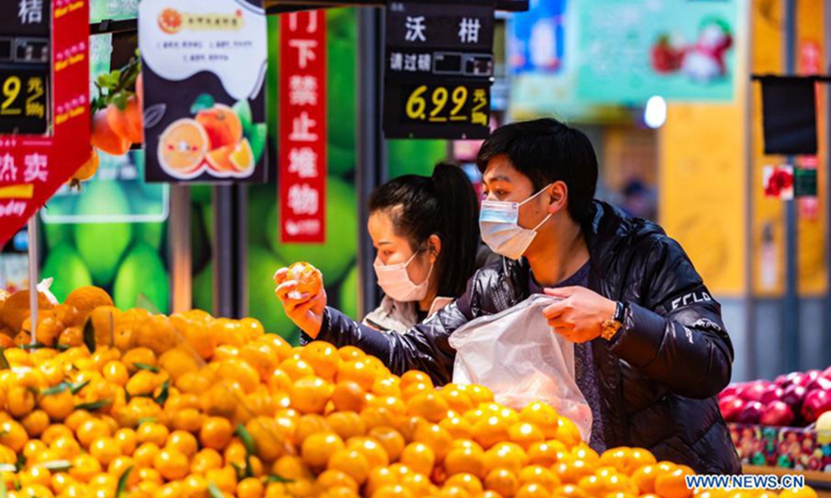 People select food at a supermarket in Xixiu District of Anshun, Southwest China's Guizhou Province. File Photo: Xinhua