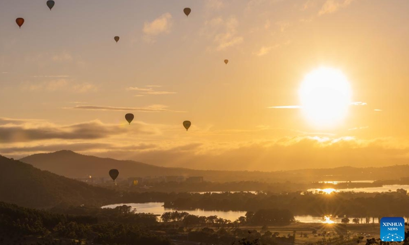 Hot air balloons fly above the Lake Burley Griffin during the annual Canberra Balloon Spectacular festival in Canberra, Australia, March 14, 2023. The annual Canberra Balloon Spectacular festival, a hot air balloon festival, is held this year from March 11 to 19. (Photo:Xinhua)