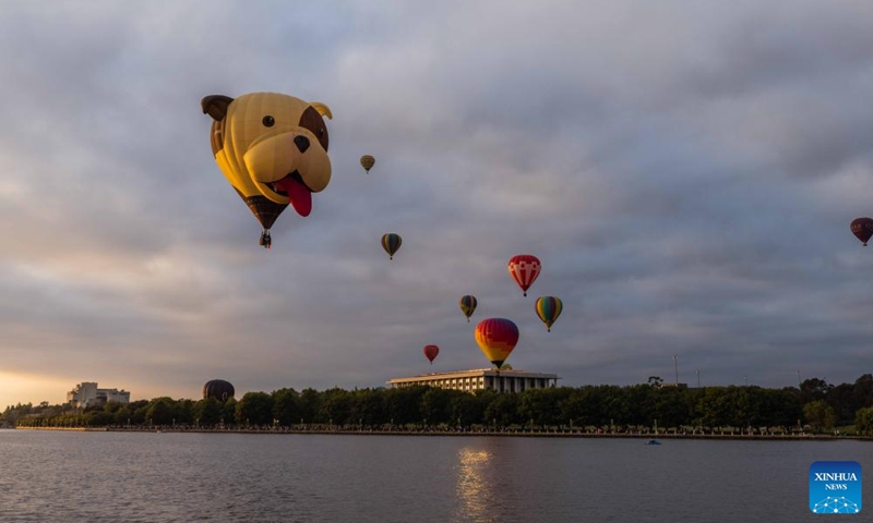 Hot air balloons are seen in the sky during the annual Canberra Balloon Spectacular festival in Canberra, Australia, March 12, 2023. The annual Canberra Balloon Spectacular festival, a hot air balloon festival, is held this year from March 11 to 19. (Photo:Xinhua)