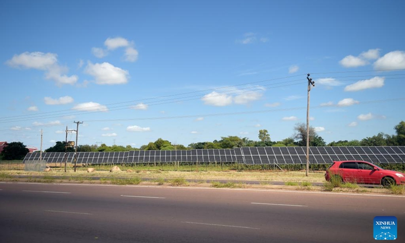 A car passes solar panels at Botswana University of Agriculture and Natural Resources in Gaborone, Botswana, on March 15, 2023. Botswana University of Agriculture and Natural Resources (BUAN) launched an Agrivoltaic project, the first of its kind in the southern African country, in Gaborone, the capital of Botswana, on Wednesday. Agrivoltaic is a concept that combines food production (both crops and livestock) with photovoltaic electricity generation.(Photo: Xinhua)
