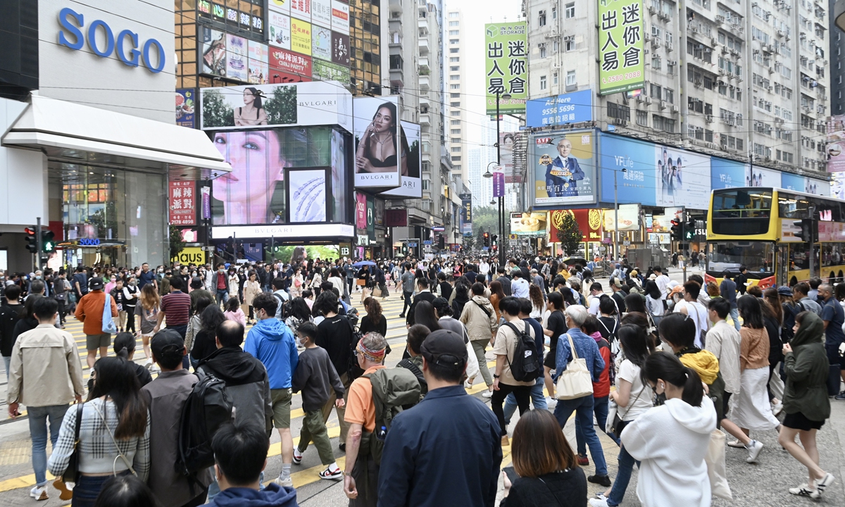 The streets of Causeway Bay, a famous shopping area of Hong Kong Special Administrative Region, are crowded with people on March 19, 2023. According to statistics released by local government, the number of mainland tourists visiting Hong Kong reached 102,458 a day earlier. Photo: VCG