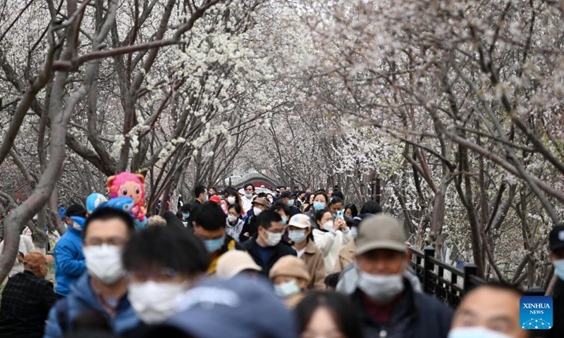 People visit the peach blossom embankment along the Grand Canal in Hongqiao district, north China's Tianjin, on March 19, 2023. As the weather gets warmer, the peach blossoms here are in full bloom and have attracted many tourists. (Xinhua/Zhao Zishuo)
