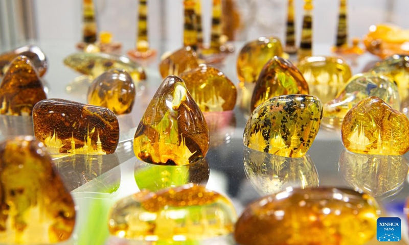 This photo taken on March 17, 2023 shows amber products on the International Baltic Jewelry Show in Vilnius, Lithuania. The 19th International Baltic Jewelry Show titled Amber Trip was held from March 15 to 18 in Vilnius. (Photo:Xinhua)
