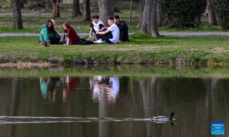 People enjoy the scenery at a park in Skopje, North Macedonia, March 20, 2023.(Photo: Xinhua)