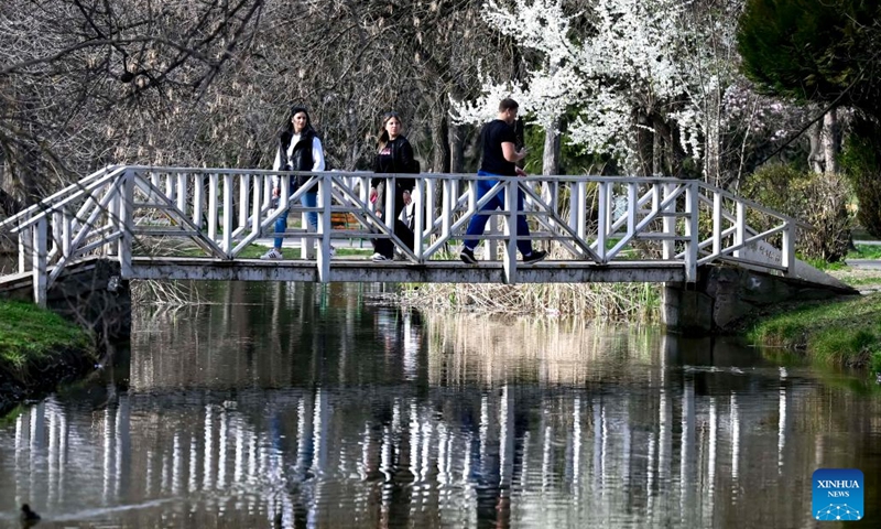 People enjoy the scenery at a park in Skopje, North Macedonia, March 20, 2023.(Photo: Xinhua)
