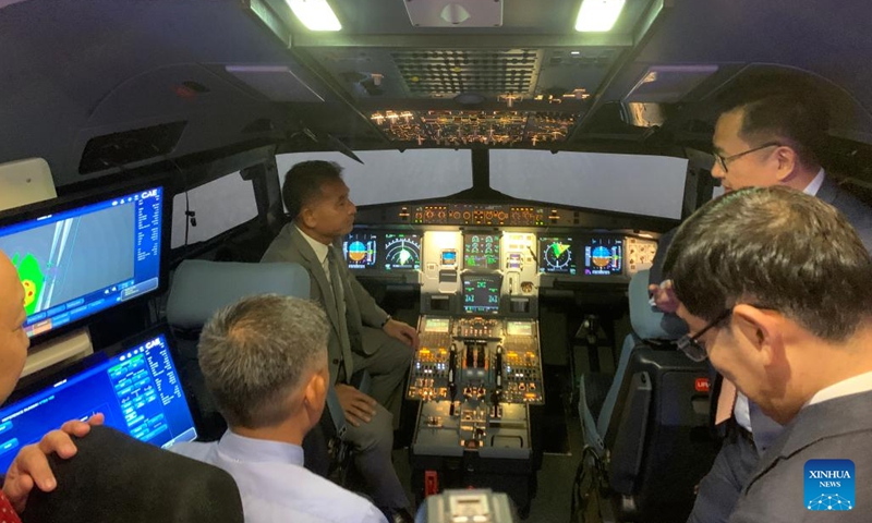 Guests visit an Airbus 320 series full-motion simulator in Phnom Penh, Cambodia on March 21, 2023.(Photo: Xinhua)