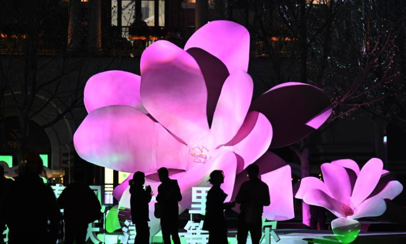Tourists visit the Wudadao historical urban area, or the Five Great Avenues, in north China's Tianjin, March 31, 2023. The Wudadao historical urban area, or the Five Great Avenues, in north China's Tianjin attracted flocks of visitors during the blooming season of Chinese flowering crabapple recently. In order to further embrace the tourism boom brought by the blossoms, Heping District of Tianjin launched a series of events themed on Chinese flowering crabapple from March 31 to April 9, featuring float parade, light show and cultural fair. (Xinhua/Zhao Zishuo)

