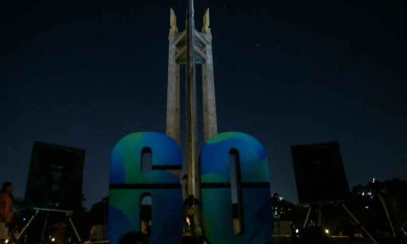 The Quezon Memorial Shrine goes dark during the Earth Hour event in Quezon City, the Philippines, March 25, 2023. Earth Hour is a worldwide movement organized by the World Wildlife Fund. The event is held annually, encouraging individuals, communities, and businesses to turn off non-essential electric lights, for one hour, from 8:30 p.m. to 9:30 p.m. on the Saturday of March, as a symbol of commitment to the planet. (Xinhua/Rouelle Umali)