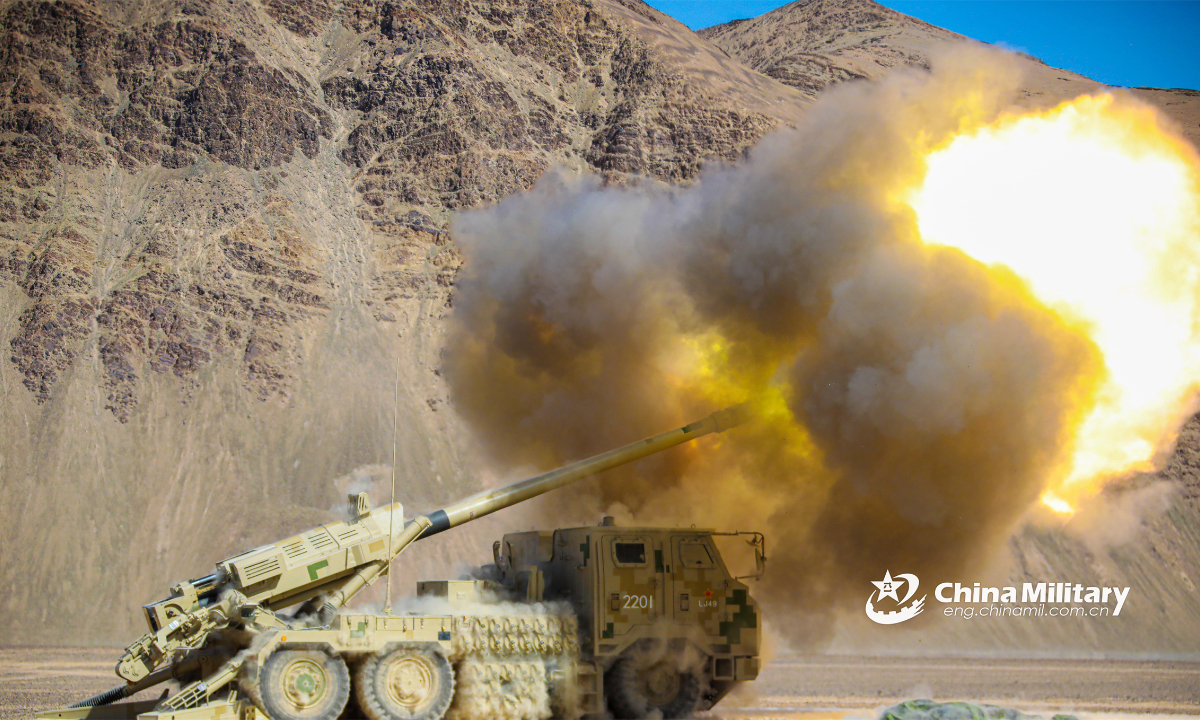 Truck-mounted artillery attached to an army artillery regiment fires at the mock target during a live-fire field training exercise at the altitude of 5,000 meters on March 24, 2023. (eng.chinamil.com.cn/Photo by Chen Ming)