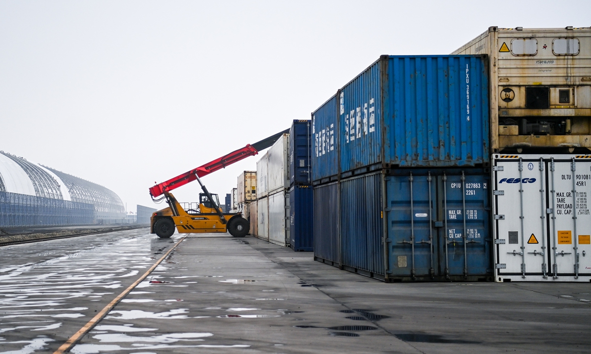 A truck carries containers at a railway port in Hunchun, northeast China's Jilin Province on March 22, 2023. Hunchun, as a major trade channel, has the railway port and the highway port to Russia. Photo: Xinhua 