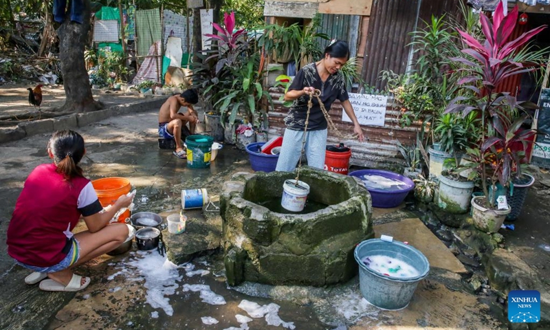 A resident fetches water from a well at a residential area on the occasion of World Water Day in Quezon City, the Philippines, March 22, 2023. (Xinhua/Rouelle Umali)