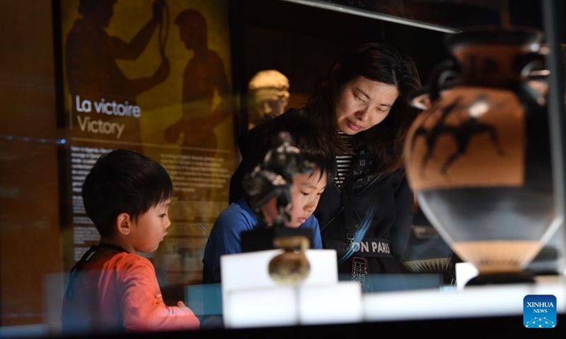 People visit the exhibitions at the International Olympic Museum in Lausanne, Switzerland, March 21, 2023. (Xinhua/Lian Yi)