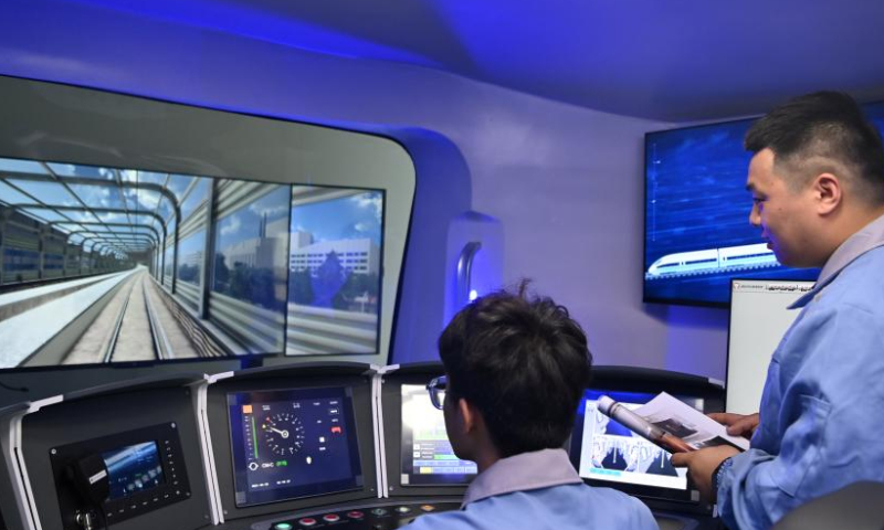 Employees work in a driving simulator of Traffic Control Technology Equipment Co., Ltd. in Wuqing District, north China's Tianjin, April 3, 2023. The Traffic Control Technology Equipment Co., Ltd. in north China's Tianjin is seeing a continuous increase in order volume this year. Inside the factory, dozens of machines are running at full capacity, and rows of circuit boards for the train operation control system are waiting to be delivered after rolling off automatic production lines.
Headquartered in Beijing, the enterprise officially went into production in 2020. It has reduced the operation cost by about 30% thanks to the supportive polices provided by the coordinated development of the Beijing-Tianjin-Hebei region. (Xinhua/Li Ran)