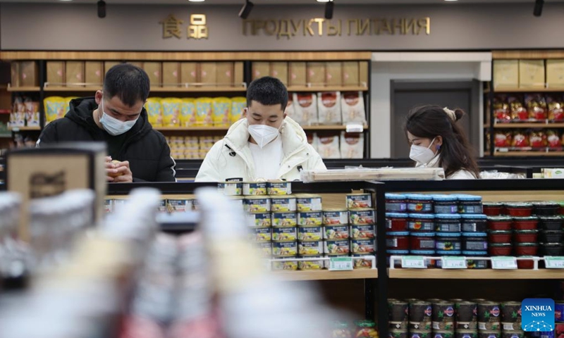 People shop at a Russian goods store in Manzhouli, north China's Inner Mongolia Autonomous Region, March 16, 2023. Popularity of Russian goods and foods has revived among local customers after the land port of Manzhouli resumes services. (Xinhua/Wang Kaiyan)