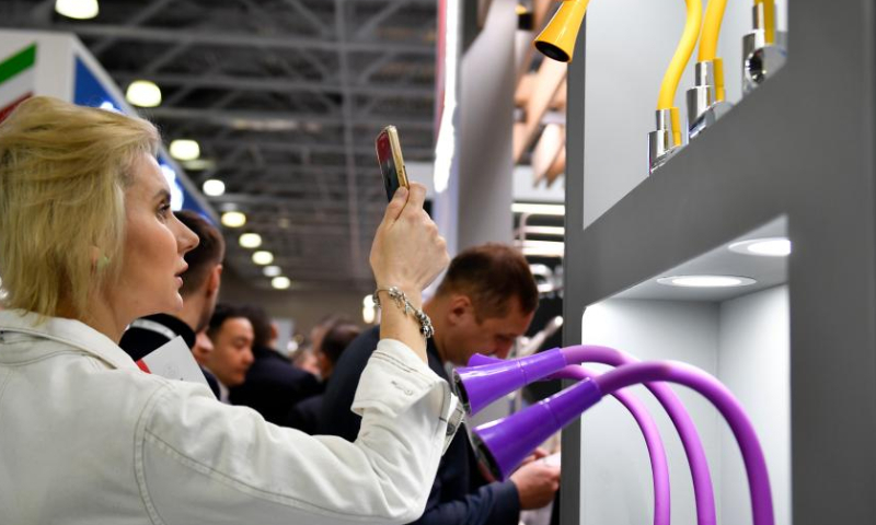 People visit MosBuild, the 28th International Building and Interiors Trade Show, at Crocus Expo International Exhibition Center in Moscow, Russia, on March 28, 2023. The MosBuild is held here from March 28 to March 31. (Photo by Alexander Zemlianichenko Jr/Xinhua)