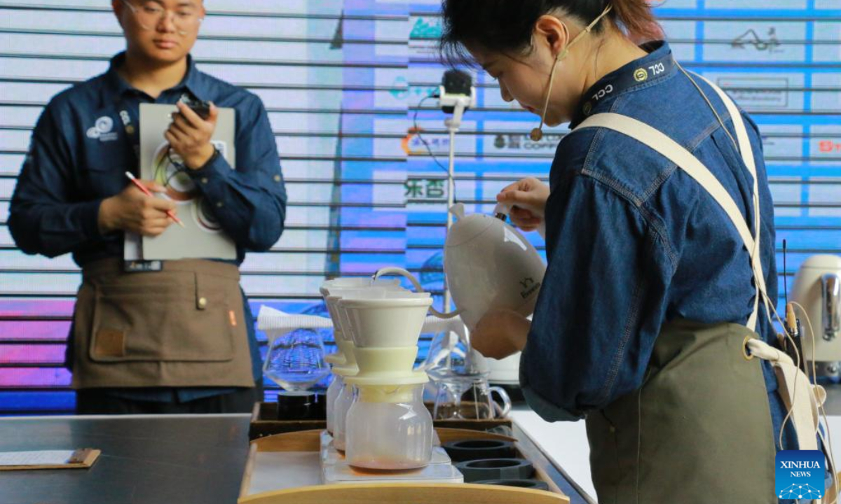 A woman participates in a competition at the 8th China Coffee Brewers Cup in Baoshan, southwest China's Yunnan Province, March 16, 2023. Photo:Xinhua