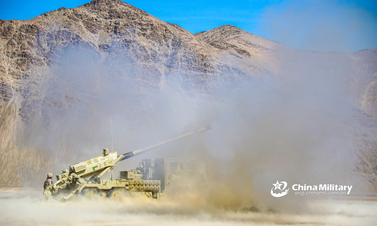 Truck-mounted artillery attached to an army artillery regiment fires at the mock target during a live-fire field training exercise at the altitude of 5,000 meters on March 24, 2023. Photo: China Military
