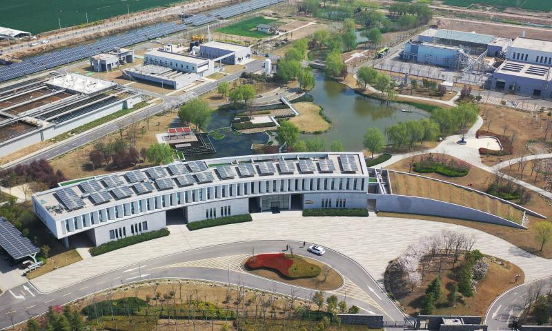 This aerial photo taken on March 28, 2023 shows the No. 3 sewage treatment plant in Suixian County of Shangqiu, central China's Henan Province. The No. 3 sewage treatment plant of Suixian County, completed in 2018, is a new concept sewage treatment facility combining wastewater treatment, biomass power generation, scientific research, science popularization, and eco-agriculture demonstration functions. The high-standard recycled water processed by the plant has improved the water quality of the local Limin river. (Xinhua/Zhang Haoran)