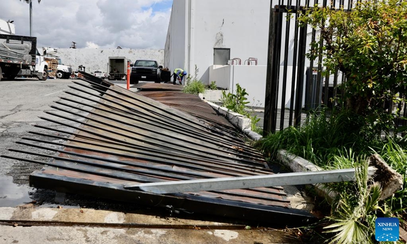 Photo taken on March 23, 2023 shows an iron fence damaged by a tornado in the city of Montebello, Los Angeles, the United States. Los Angeles area was hit by a rare tornado on Wednesday, the strongest one to impact LA Metro area since March 1983, according to the U.S. National Weather Service (NWS).(Photo: Xinhua)