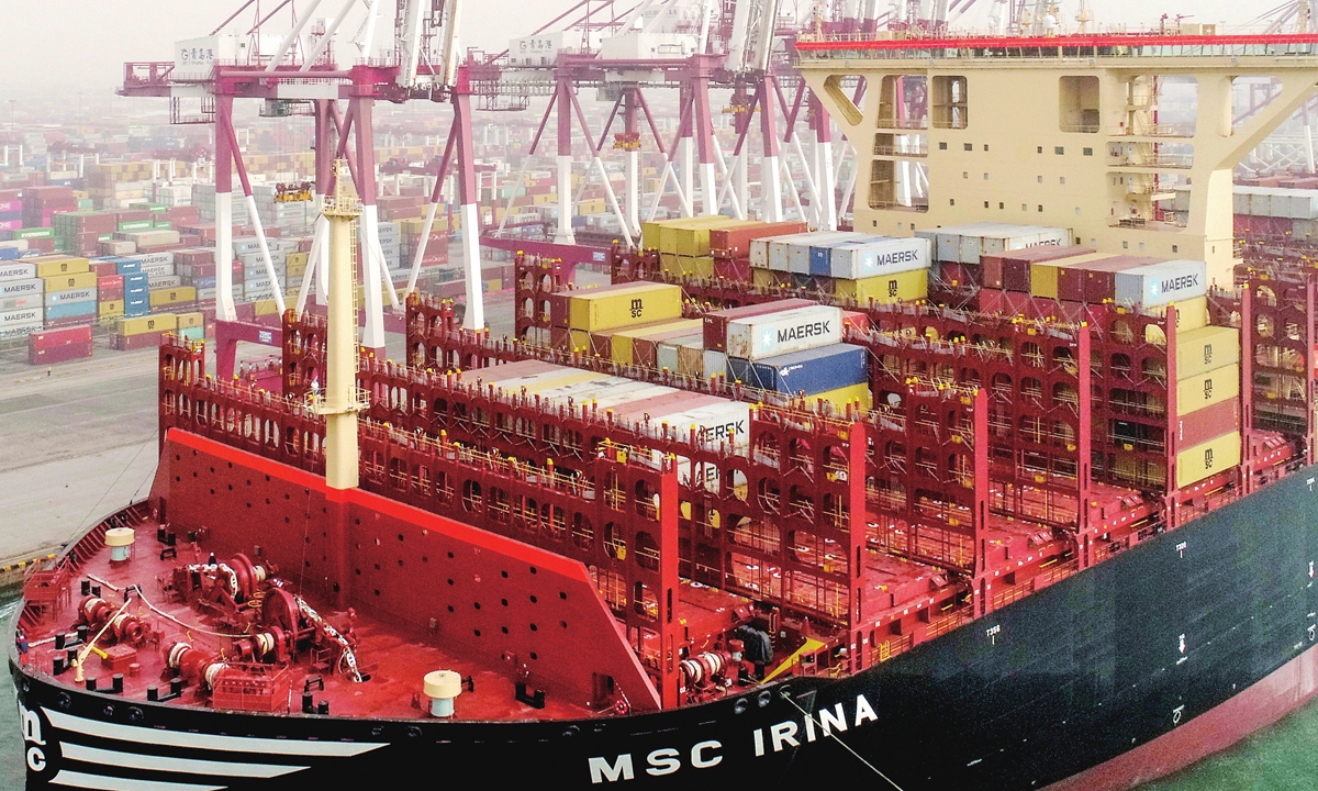 The world's largest ultra-large containership, which was developed by China, sets sail and starts its first commercial journey from Qingdao port in East China's Shandong Province on March 23, 2023. The vessel, with a length of 399.99 meters and a width of 61.3 meters, can carry 24,346 standard containers at a time. Photo: cnsphoto