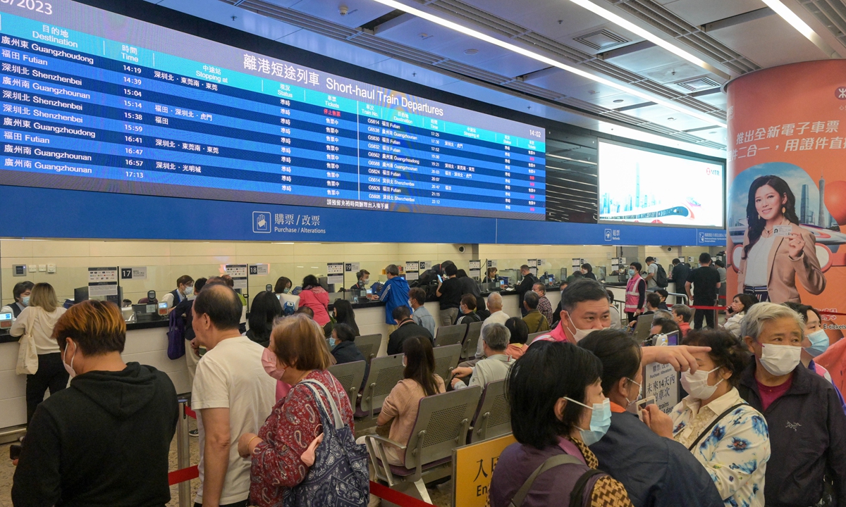 Passengers buy tickets at Hong Kong West Kowloon Station on March 23, 2023. That's the day the station began selling cross-provincial long-distance tickets for the Guangzhou-Shenzhen-Hong Kong Express Rail Link, which will resume on April 1. Photo: cnsphoto