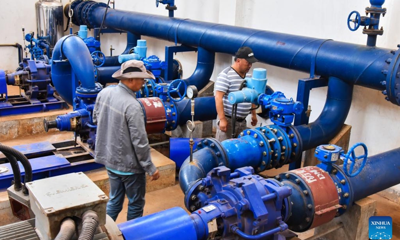Staff members check the treated water pumping station at the water treatment plant in Bafoussam, Cameroon, March 2, 2023.(Photo: Xinhua)